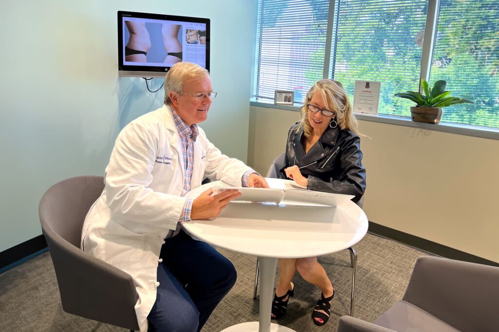 Dr. Claytor with Patient During a Consultation