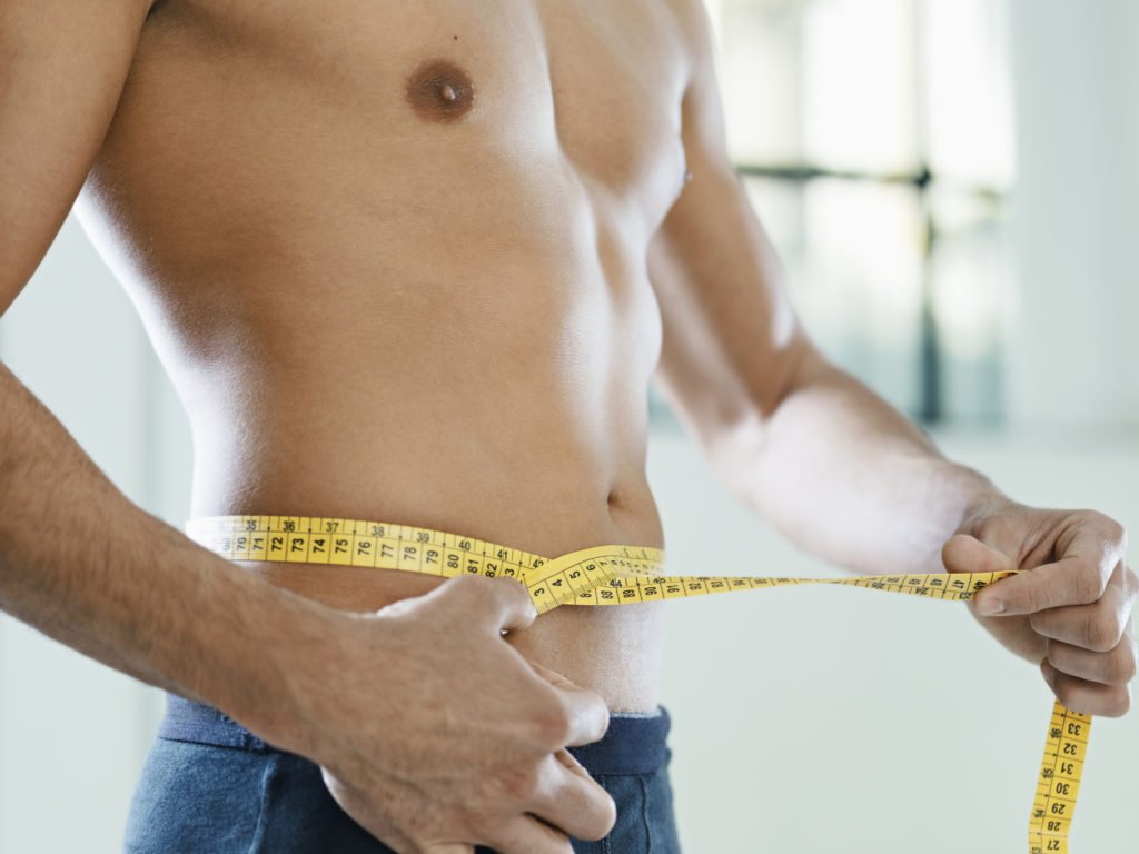 Man using body measuring tape