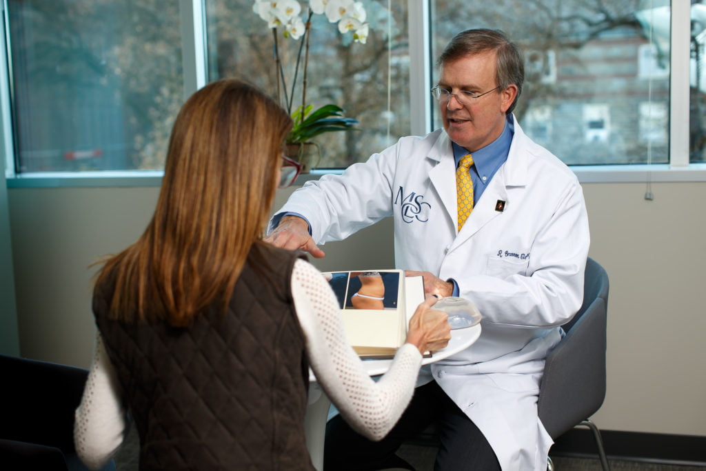Dr. Claytor discusses mommy makeovers during a patient consultation Dr. Claytor discusses Philadelphia mommy makeover options during a patient consultation
