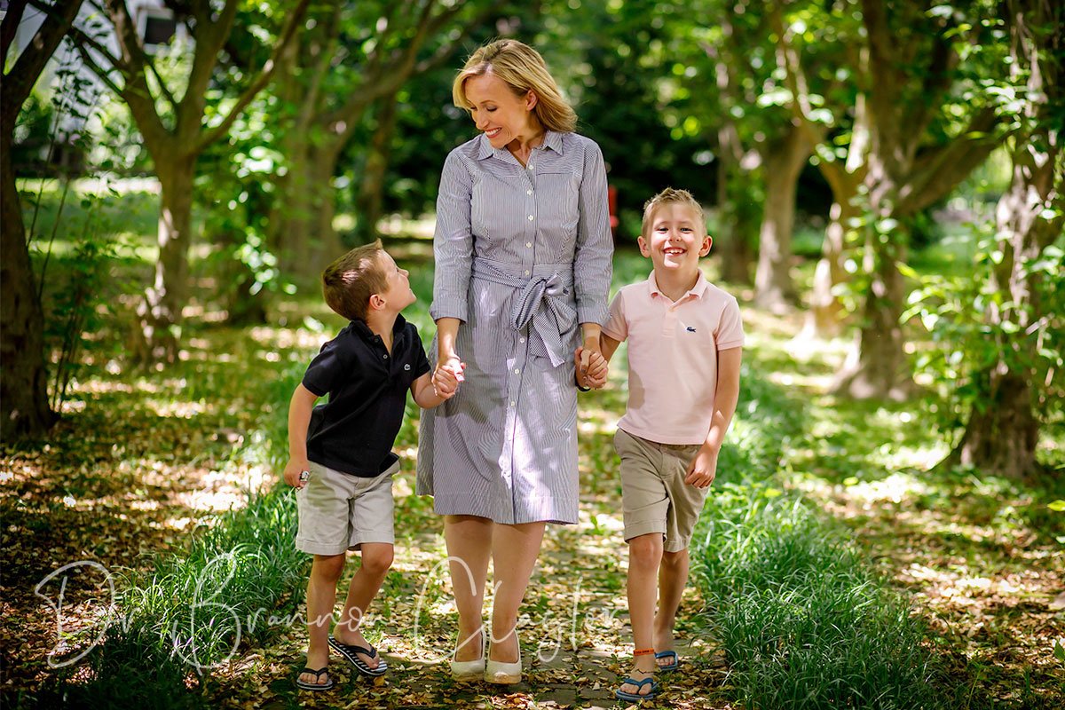 Actual mommy makeover patient with her two children Actual Mommy Makeover Patient of Claytor Noone Plastic Surgery walking with her two children