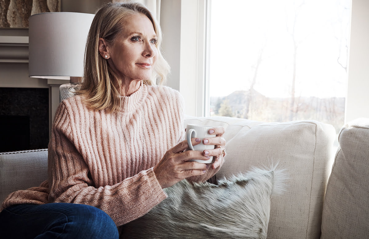 woman enjoys coffee at home after facelift