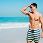 Man Enjoys the Beach After CoolSculpting Treatments Summer 2021