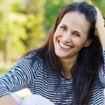 Happy Mature Woman Smiling Enjoying Results of Facelift with Dr. Claytor