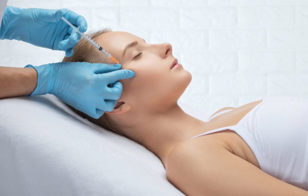 Woman getting injectable wrinkle treatment after Daxxify Botox cost comparison