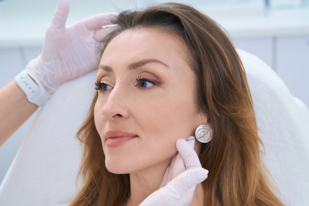 Woman consults with a plastic surgeon about a facelift procedure
