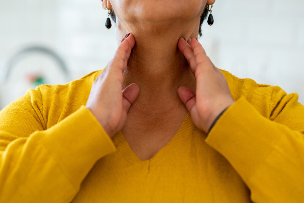 Woman doing neck exercises to treat turkey neck