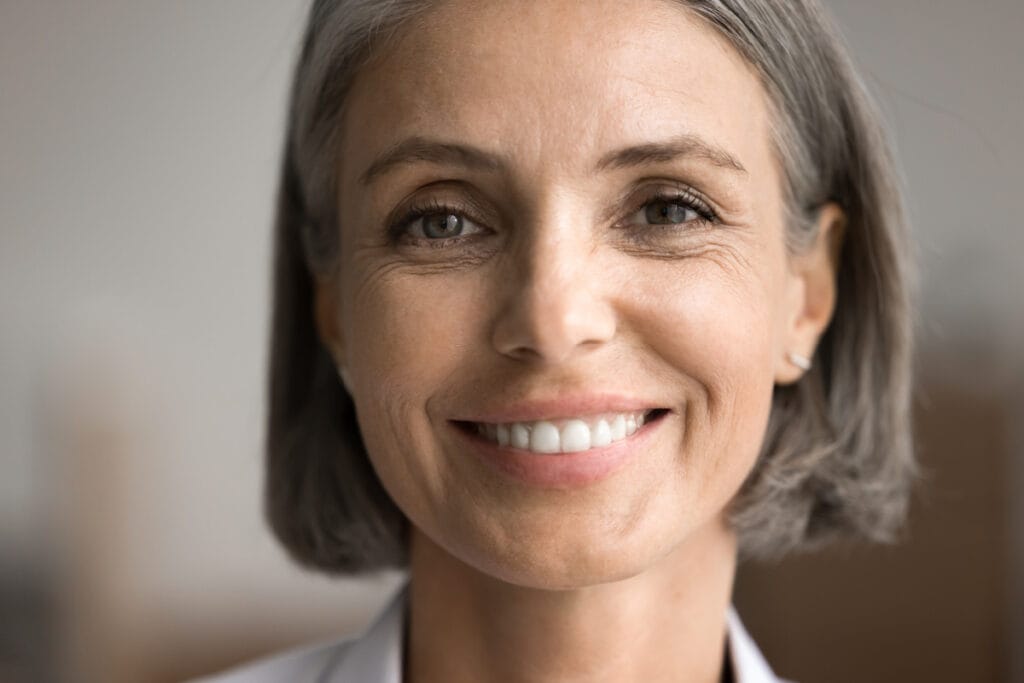 Close up of a mature 50s woman smiling